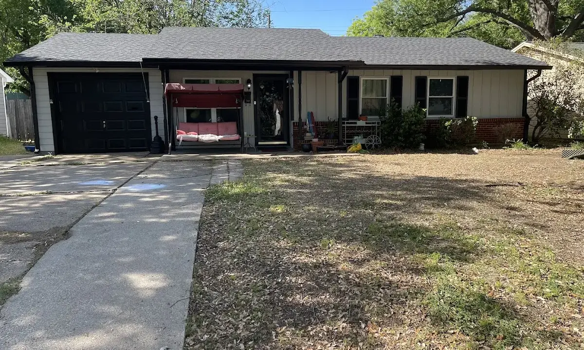 Asphalt Shingle Roof Repair crew at work on a residential roof in Seminole